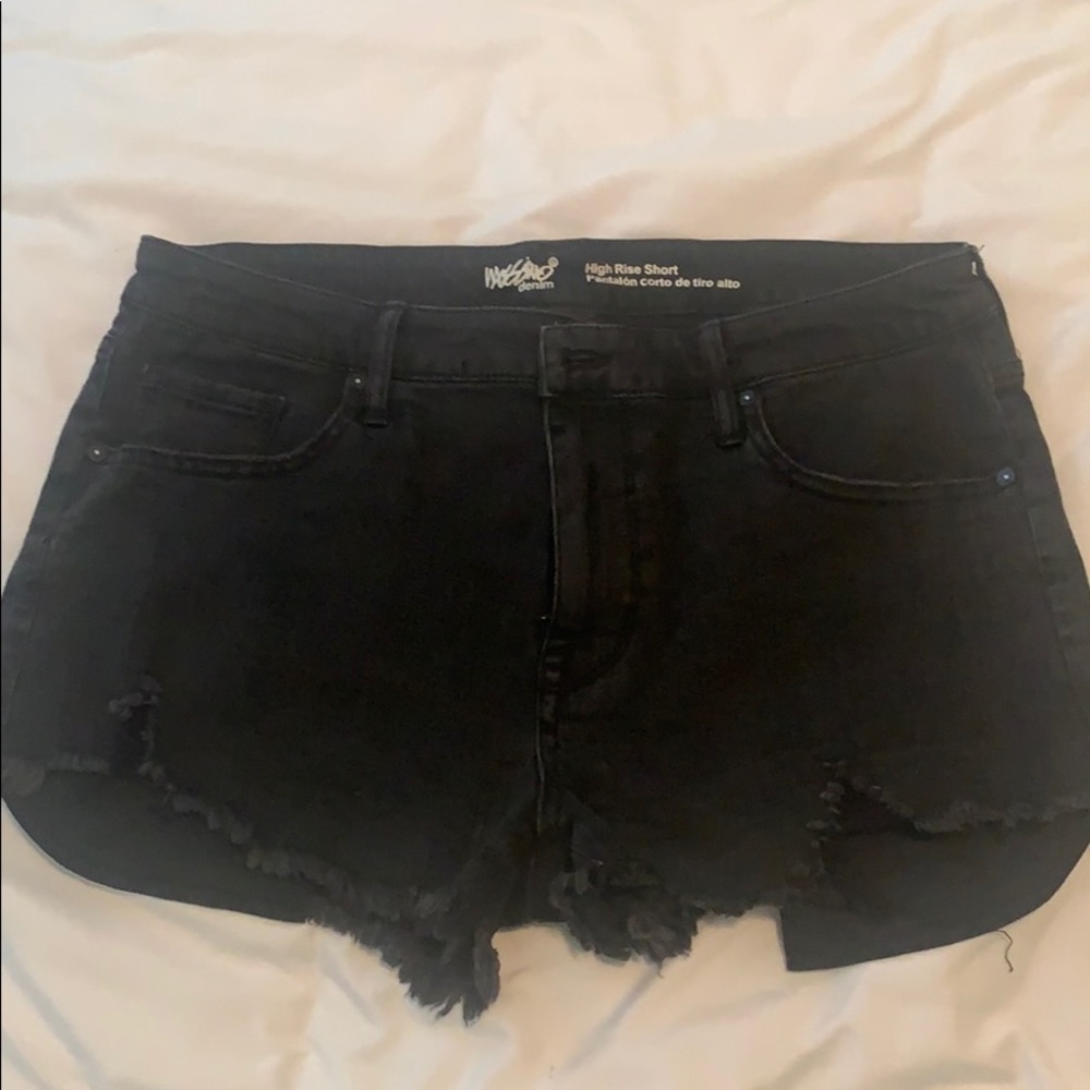 Black denim shorts. Distressed detailing